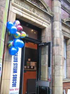 Photo of a bunch of balloons by the baths entrance