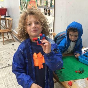 Children showing their
lego designs